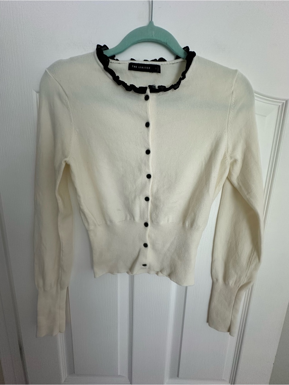 The Limited Cream Cardigan with Black Ruffle Trim